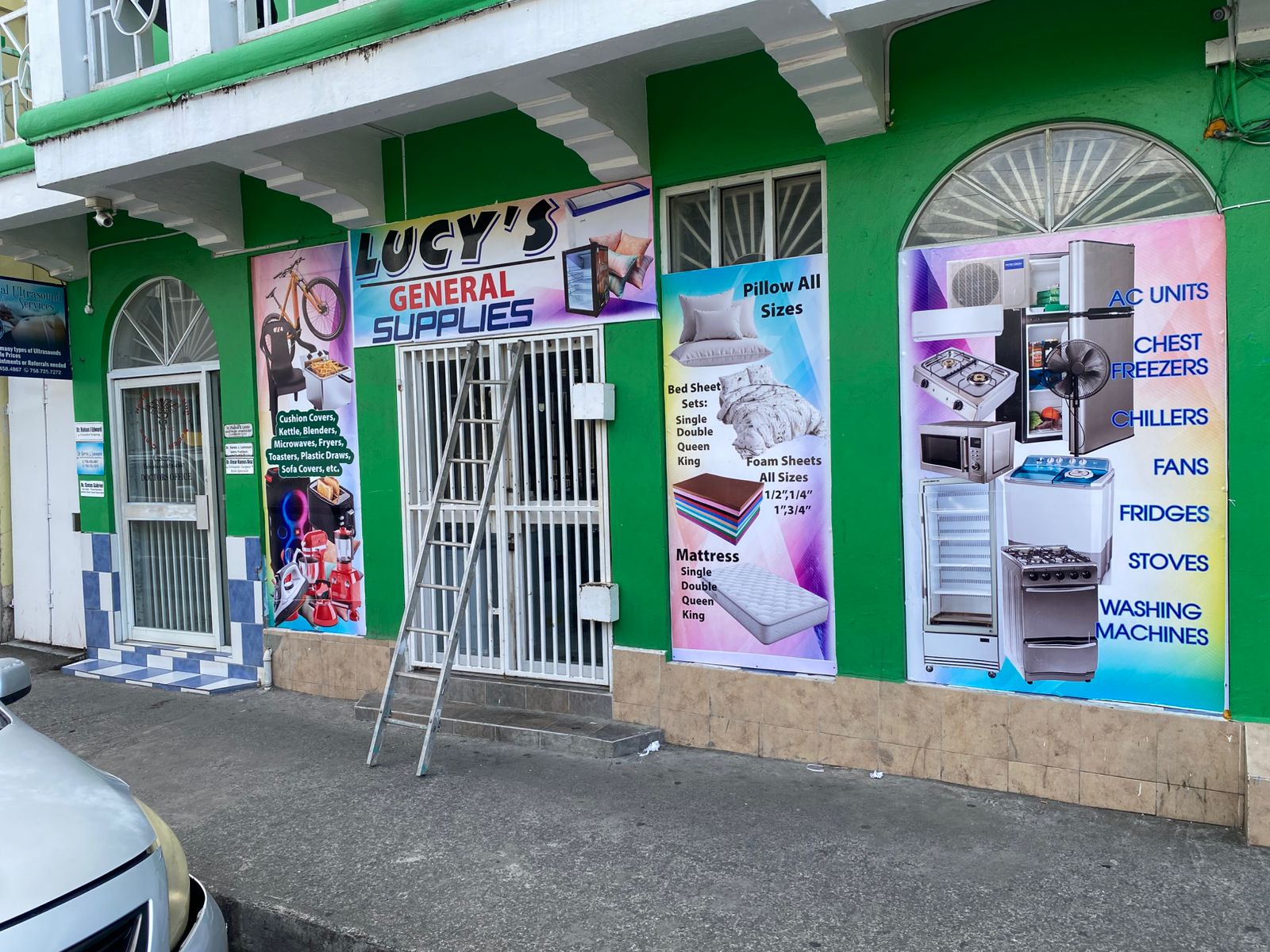 Completed storefront graphics on a Saint Lucian shop