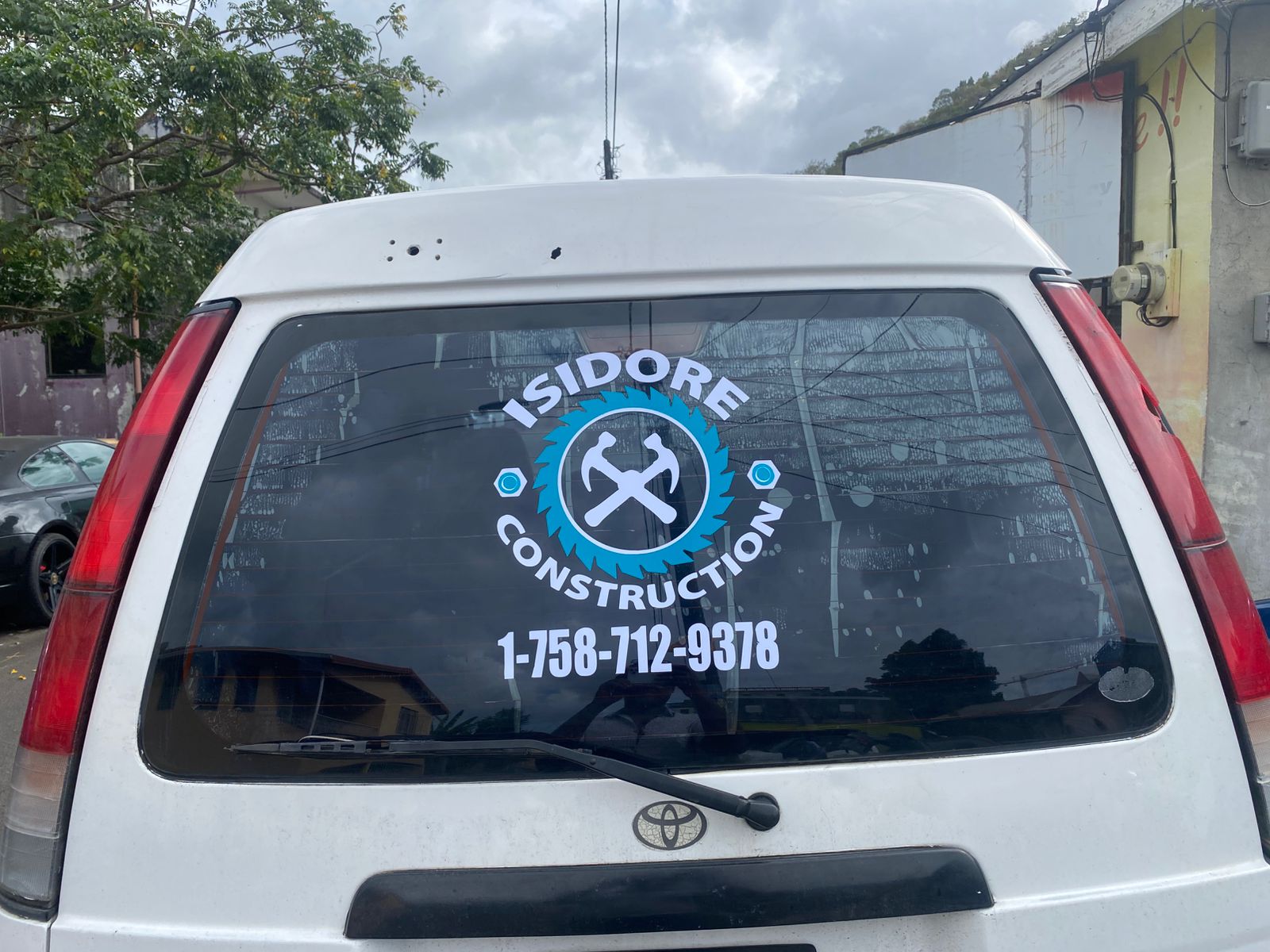 White vehicle with rear window branding